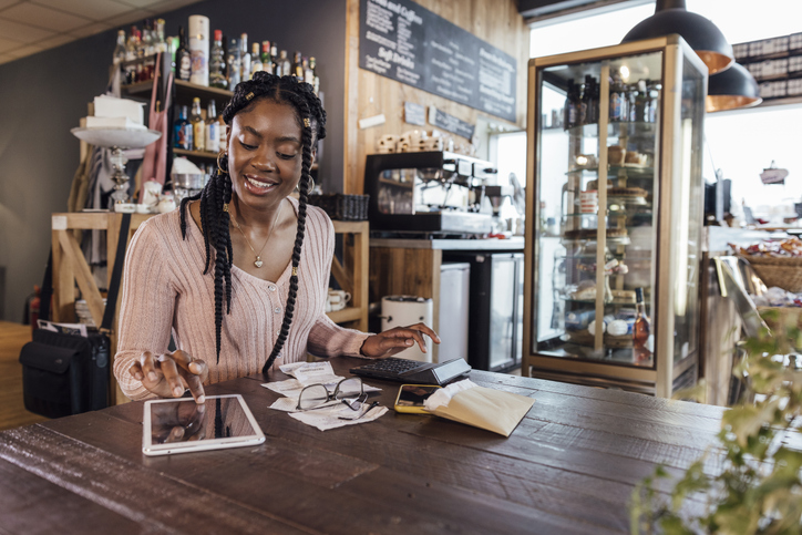 Businesswoman Calculating Finances